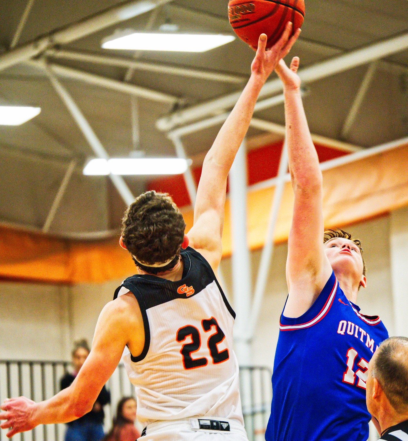 Landon Richey (12) fights for the tipoff to begin the first overtime period.